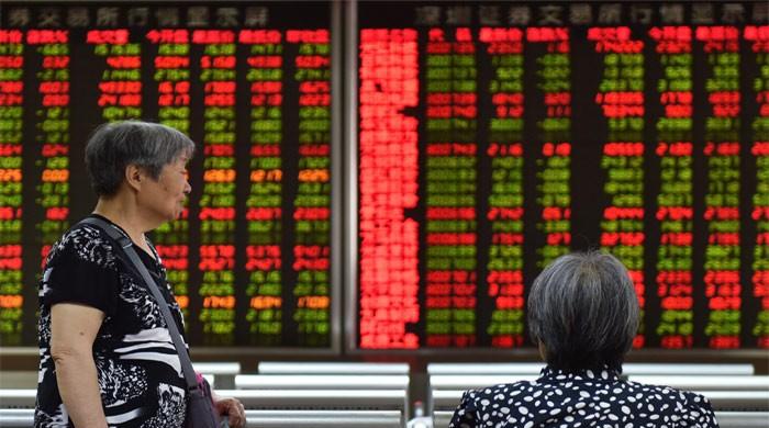 Asian markets mixed as dealers await trade news, Hong Kong rises