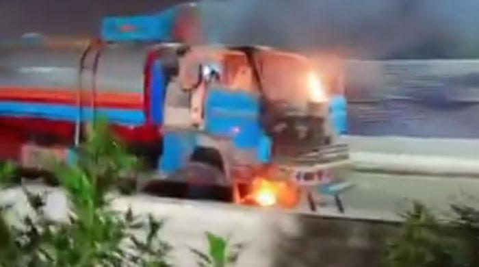 Five trucks set on fire after speeding tanker kills another biker in Karachi