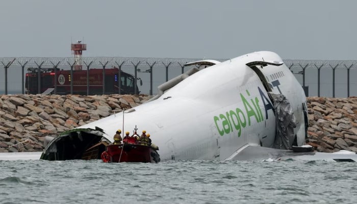 Hong Kong cargo plane skids off runway, two airport staff killed 10 Hong Kong cargo plane skids off runway, two airport staff killed