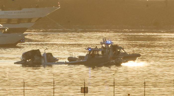 More than 60 feared dead after jet hits helicopter, crashes into Washington river