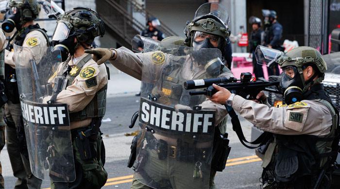 Nighttime curfew in LA as Trump vows to 'liberate' city