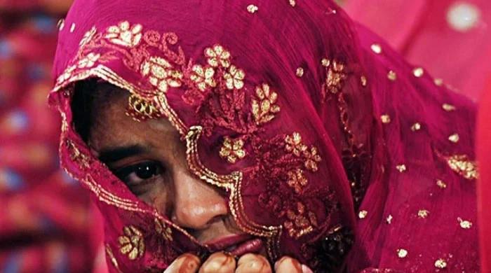 President signs law fixing 18 as minimum legal marriage age