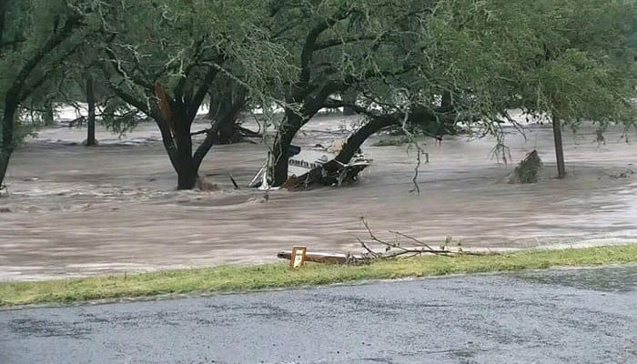 Texas floods leave 13 dead, over 20 campers missing