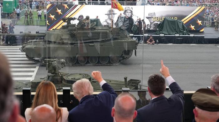 Trump flexes military might at parade as protests sweep US 1 Trump flexes military might at parade as protests sweep US